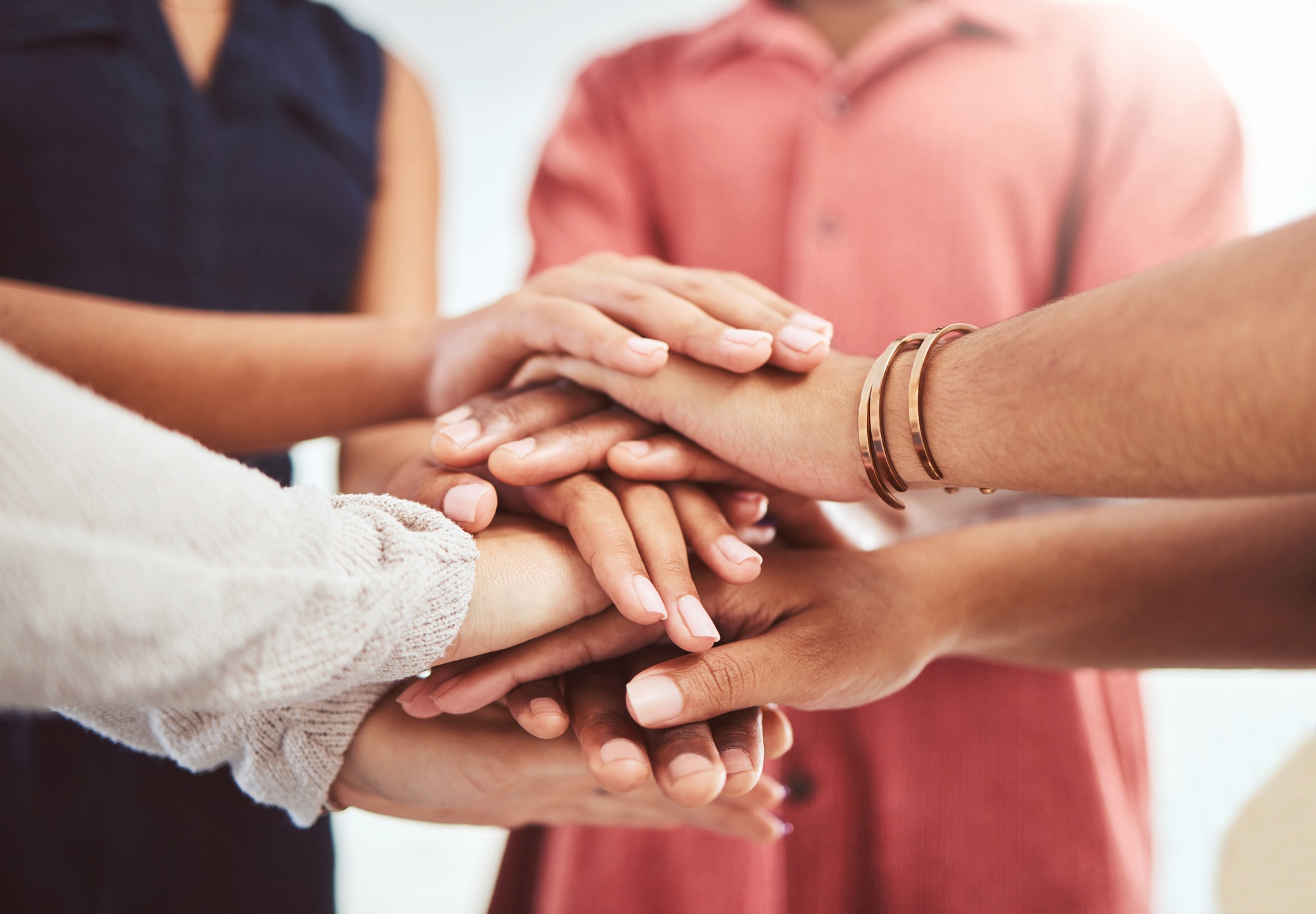 Hands, support and motivation of diversity of friends showing a helping hand and community. People